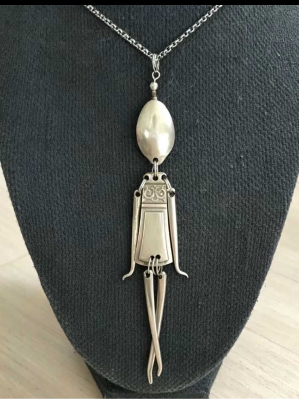 Sterling Tone Articulated Pendant Necklace in Silver